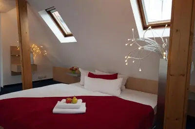 Ein Bett oder Betten in einem Zimmer der Unterkunft Hotel König