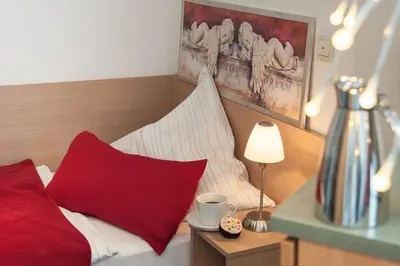 Ein Bett oder Betten in einem Zimmer der Unterkunft Hotel König