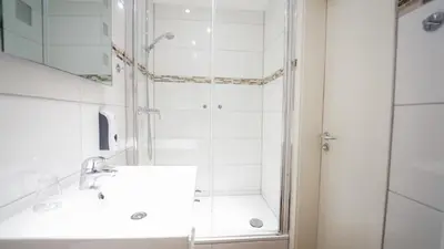 Ein Badezimmer in der Unterkunft Hotel König