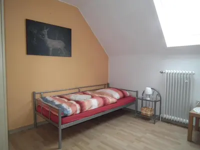 Ein Bett oder Betten in einem Zimmer der Unterkunft Ferienwohnung 