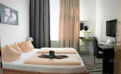 Ein Bett oder Betten in einem Zimmer der Unterkunft Hotel Antoni