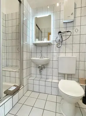 Ein Badezimmer in der Unterkunft Hotel Antoni