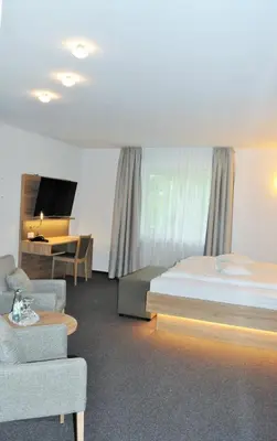 Ein Bett oder Betten in einem Zimmer der Unterkunft Hotel Restaurant Große Teichsmühle