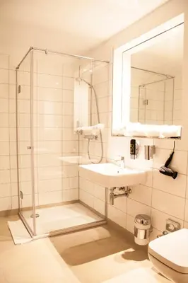 Ein Badezimmer in der Unterkunft Hotel Specht by Trotmannia