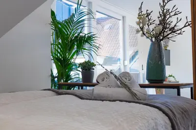 Ein Bett oder Betten in einem Zimmer der Unterkunft Apartments an der Universität