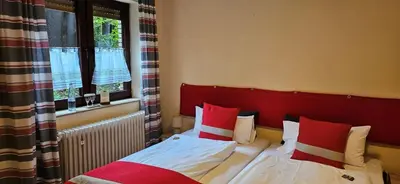 Ein Bett oder Betten in einem Zimmer der Unterkunft Haus Scheuten Hotel