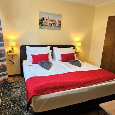 Ein Bett oder Betten in einem Zimmer der Unterkunft Haus Scheuten Hotel
