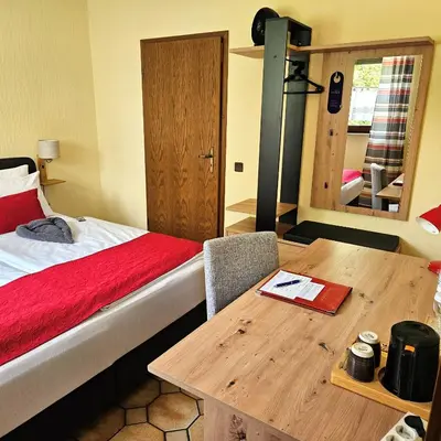 Ein Bett oder Betten in einem Zimmer der Unterkunft Haus Scheuten Hotel