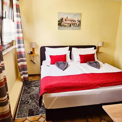 Ein Bett oder Betten in einem Zimmer der Unterkunft Haus Scheuten Hotel