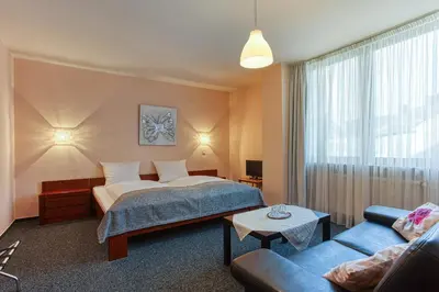 Ein Bett oder Betten in einem Zimmer der Unterkunft Hotel Carlton