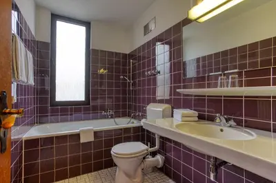 Ein Badezimmer in der Unterkunft Hotel Carlton