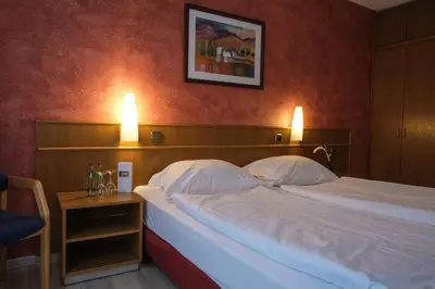 Ein Bett oder Betten in einem Zimmer der Unterkunft Hotel-Restaurant Zur Mühle