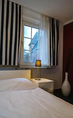 Ein Bett oder Betten in einem Zimmer der Unterkunft Hotel-Restaurant Zur Mühle