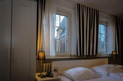 Ein Bett oder Betten in einem Zimmer der Unterkunft Hotel-Restaurant Zur Mühle