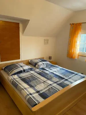 Ein Bett oder Betten in einem Zimmer der Unterkunft Ferienhaus Pacco