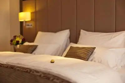 Ein Bett oder Betten in einem Zimmer der Unterkunft Favor Hotel Königsallee