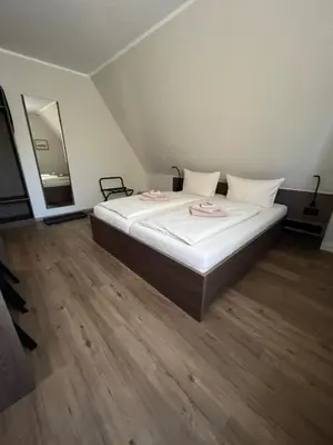 Ein Bett oder Betten in einem Zimmer der Unterkunft Hotel Stockumer Hof