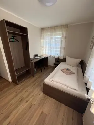 Ein Bett oder Betten in einem Zimmer der Unterkunft Hotel Stockumer Hof