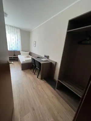 Ein Bett oder Betten in einem Zimmer der Unterkunft Hotel Stockumer Hof