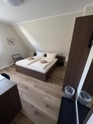 Ein Bett oder Betten in einem Zimmer der Unterkunft Hotel Stockumer Hof