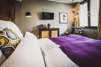 Ein Bett oder Betten in einem Zimmer der Unterkunft HENRI Hotel Düsseldorf