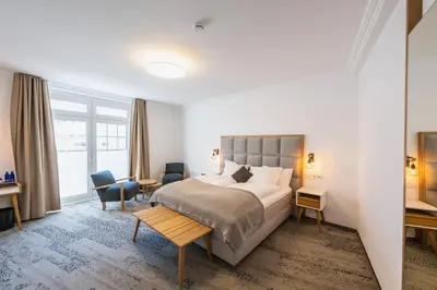 Ein Bett oder Betten in einem Zimmer der Unterkunft Ratshotel