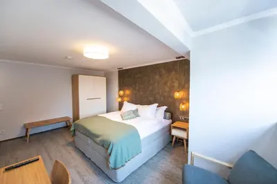 Ein Bett oder Betten in einem Zimmer der Unterkunft Ratshotel