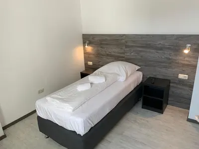 Ein Bett oder Betten in einem Zimmer der Unterkunft Casino Hotel Hamm