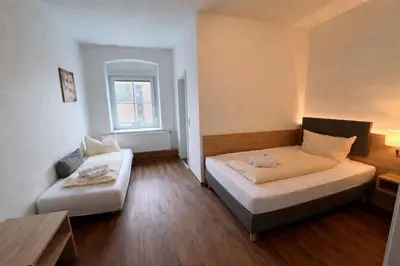 Ein Bett oder Betten in einem Zimmer der Unterkunft Tilla's Hof