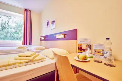Ein Bett oder Betten in einem Zimmer der Unterkunft DJH Jugendherberge Hagen