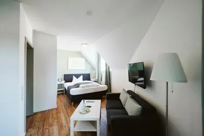 Ein Bett oder Betten in einem Zimmer der Unterkunft Hotel Grüner Baum