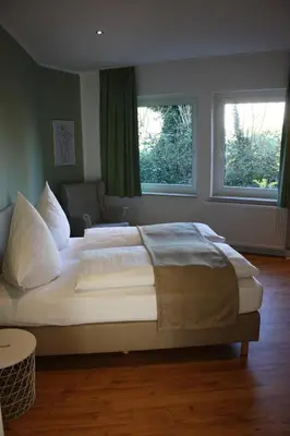 Ein Bett oder Betten in einem Zimmer der Unterkunft Hotel Grüner Baum