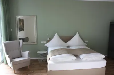 Ein Bett oder Betten in einem Zimmer der Unterkunft Hotel Grüner Baum
