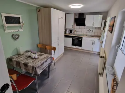 Küche/Küchenzeile in der Unterkunft Gästewohnung am Mommbach