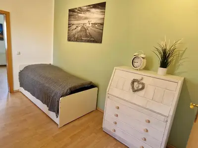 Ein Bett oder Betten in einem Zimmer der Unterkunft Gästewohnung am Mommbach