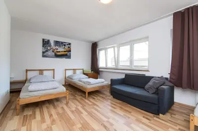 Ein Bett oder Betten in einem Zimmer der Unterkunft Oldtown Apartment Andreasstrasse