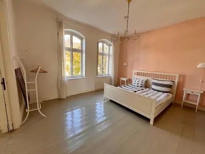 Ein Bett oder Betten in einem Zimmer der Unterkunft Beautiful apartment in a historic villa