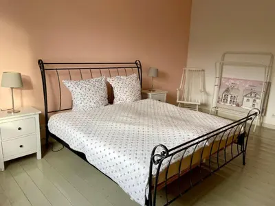 Ein Bett oder Betten in einem Zimmer der Unterkunft Beautiful apartment in a historic villa
