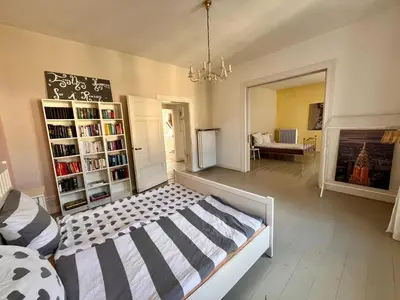 Ein Bett oder Betten in einem Zimmer der Unterkunft Beautiful apartment in a historic villa