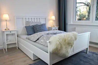 Ein Bett oder Betten in einem Zimmer der Unterkunft Apartmenthaus in der Metzstraße