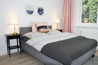 Ein Bett oder Betten in einem Zimmer der Unterkunft Apartmenthaus in der Metzstraße