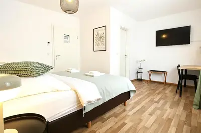 Ein Bett oder Betten in einem Zimmer der Unterkunft Airport Messe Hotel
