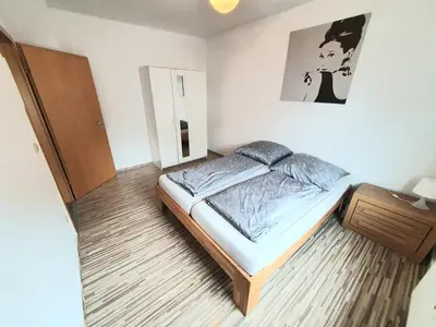 Ein Bett oder Betten in einem Zimmer der Unterkunft Lieblingsmensch Oberhausen mit Terrasse