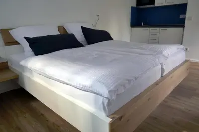 Ein Bett oder Betten in einem Zimmer der Unterkunft Messeappartement Unterrath
