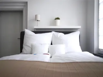 Ein Bett oder Betten in einem Zimmer der Unterkunft Fachwerk Hotel Wuppertal