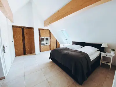 Ein Bett oder Betten in einem Zimmer der Unterkunft Fachwerk Hotel Wuppertal