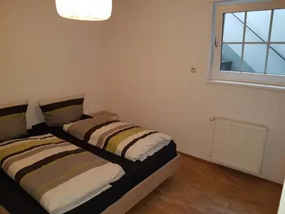 Ein Bett oder Betten in einem Zimmer der Unterkunft Wohnen im Souterrain einer Villa