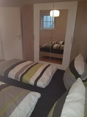 Ein Bett oder Betten in einem Zimmer der Unterkunft Wohnen im Souterrain einer Villa