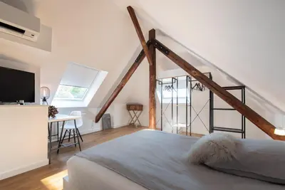 Ein Bett oder Betten in einem Zimmer der Unterkunft Design-Loft und Apartments