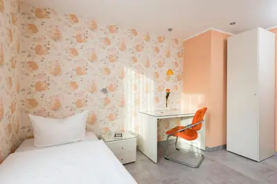 Ein Bett oder Betten in einem Zimmer der Unterkunft Appartements am Kleeblatt